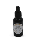 black glass bottle containing scented dryer ball oil